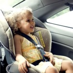 child in car seat - publicdomain