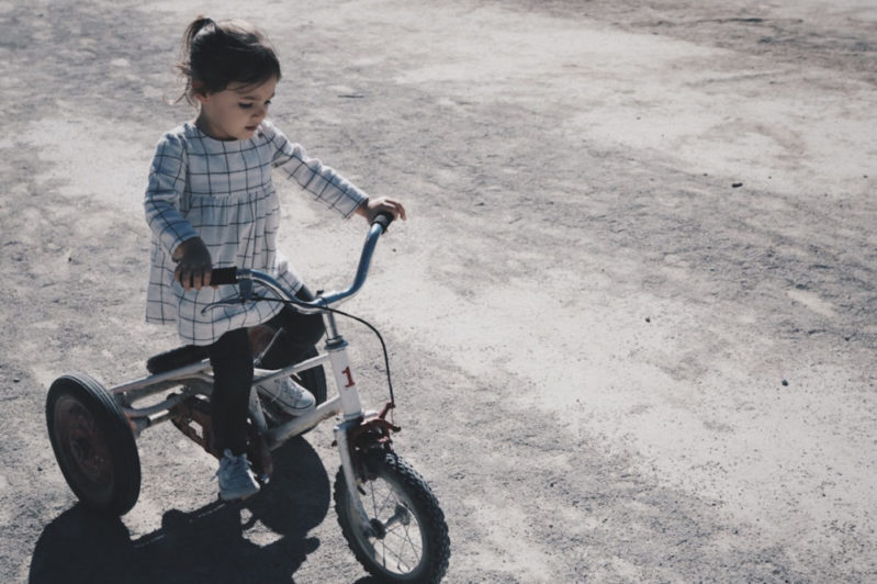 Your kindergartner doesn't need a car seat on this vehicle. But if s/he's in a car, then yes. Ideally rear-facing, but forward-facing is fine.